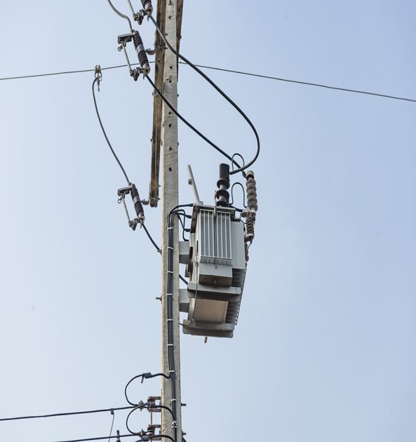 Many electrical cable - wire and telephone line on electricity post, Thailand. Wire and cable clutter.
